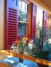 The phones rang hot with delight when colour shy Melbourne spotted this sun splashed home in Dulux colours 'Sun Lounge' with an 'Orange Squash' fence and 'Red Box ' shutters.