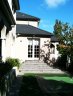 <p>This Kew exterior home looks elegant in Dulux 'Saudi Sand' 'Limed White'  and 'Domino'. Liberati Colour designed the security door and entry.</p>